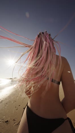 woman with braids on the beach