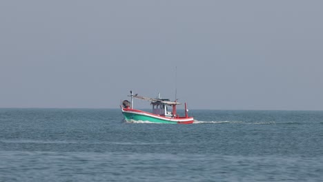 a single boat traverses the tranquil ocean waters.