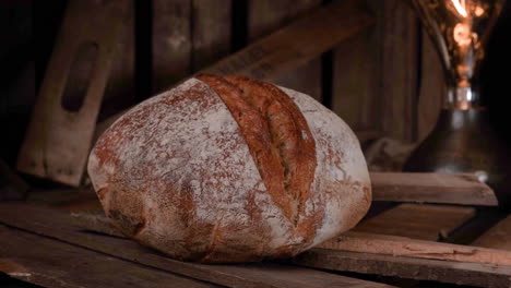 Light-Passing-Over-Delicious-Freshly-Baked-Sourdough-Bread-On-Wood-Background