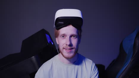 man wearing vr headset in gaming chair