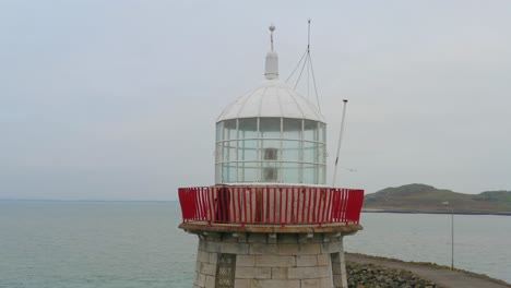 Beautiful-aerial-orbiting-gracefully-around-Howth's-lighhouse-lantern