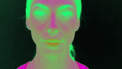 tempting woman blinking her eyes and smiling in ir infrared camera slow motion