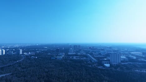 University-of-Alberta-flyover-campus-at-the-river-edge-valley-park-hiking-mountain-biking-paths-summer-lush-green-trees-auditoriums-classes-students-public-transit-train-next-o-vintage-street-car