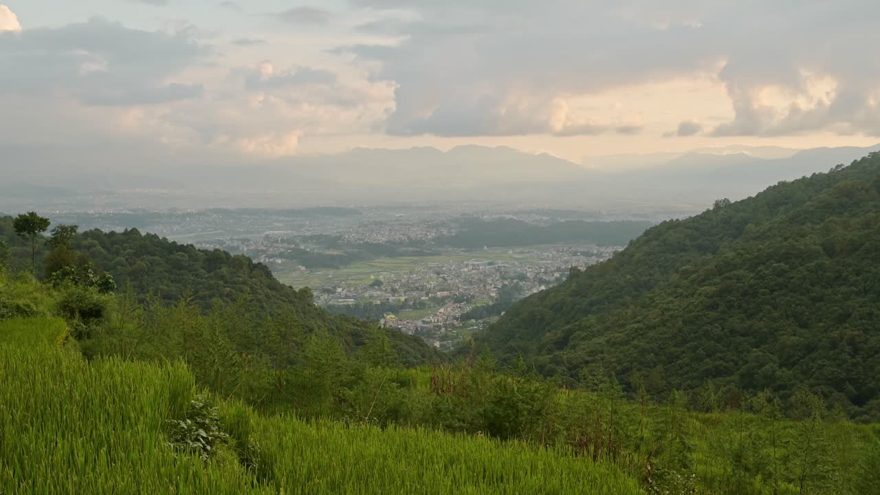 Pady Fields and Kathmandu City Sunset, Rural Landscape Scenery in Nepal with Rice Fields Paddies and Paddy Fields Terraces in a Rural Village in Kathmandu Valley with the City Behind