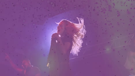 music industry djs raising hands near headphones on stage, pointing microphone amid purple haze