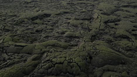 Mossy-rocks-in-the-vast-land-of-South-Iceland-during-autumn,-aerial