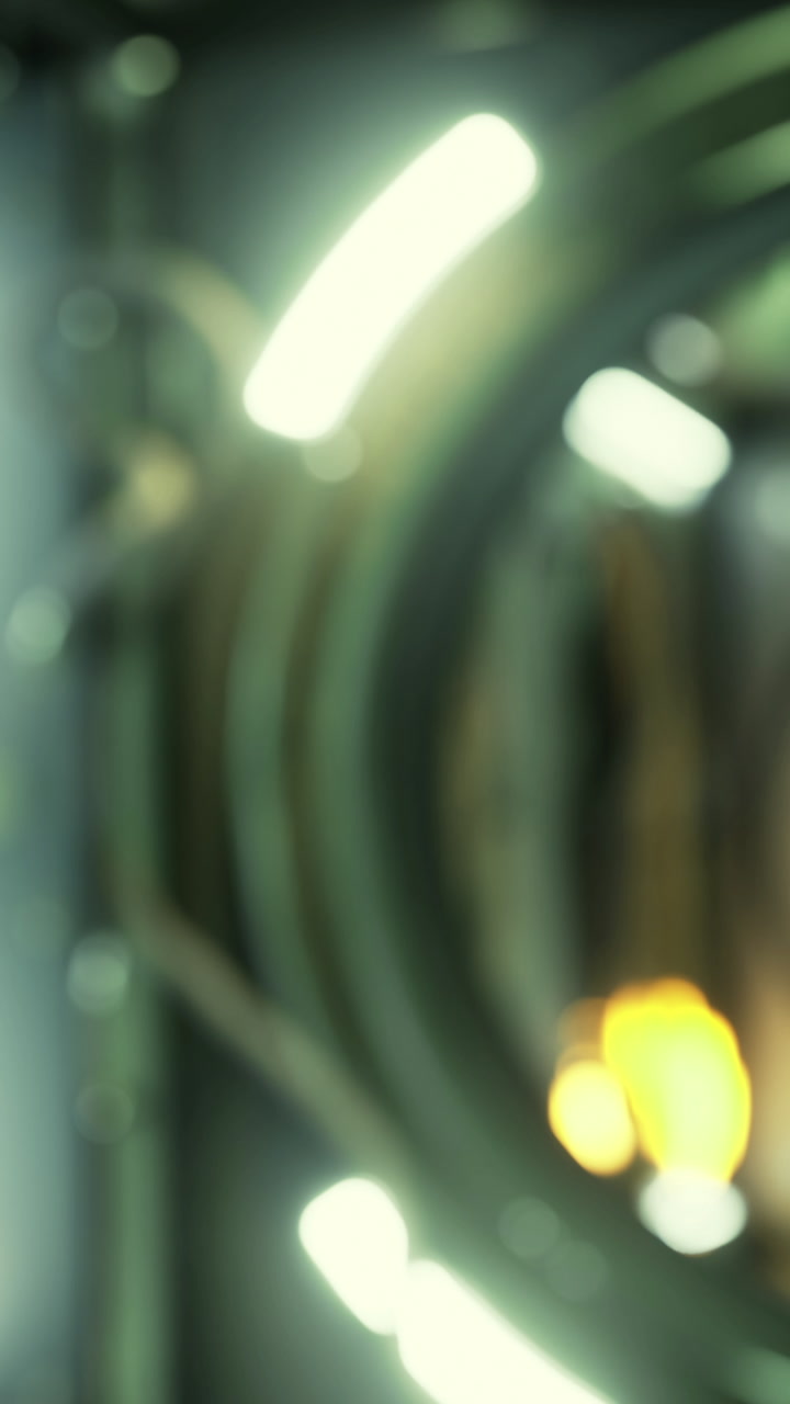 Camera lens with light reflections and blurred background during evening time