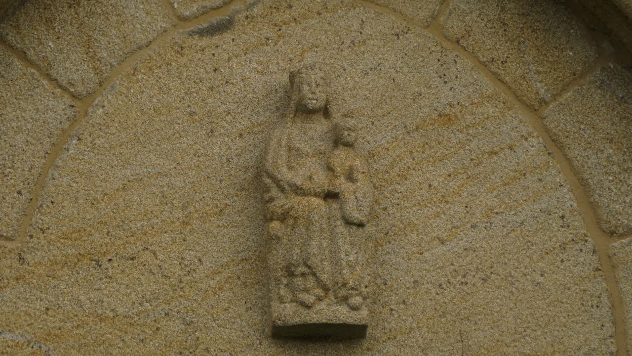 Stone statue detail on San Paio de Albán church facade in Coles, Ourense, Galicia, Spain