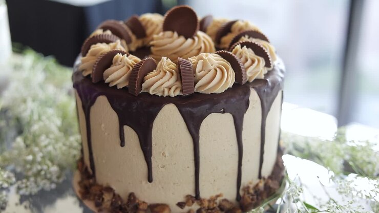 Chocolate Peanut Butter frosting with Reese's Cups on Delicious Cake