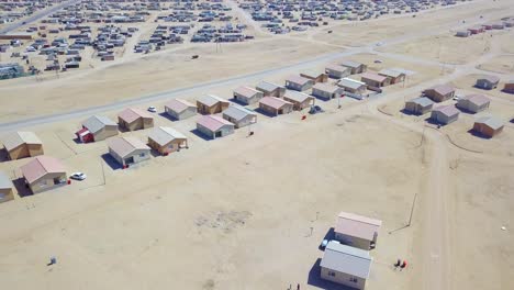 aerial over a strange abandoned town of empty lonely suburban tract houses in the desert of namibia africa 6