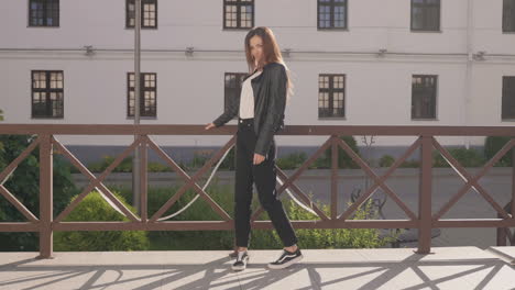 woman in a leather jacket and black pants