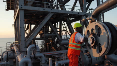 industrial worker performing maintenance on ship equipment