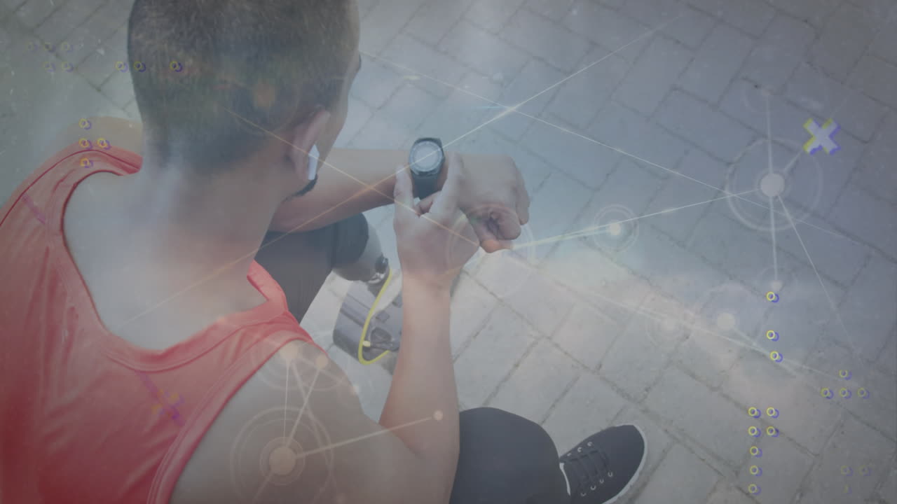 animación de puntos conectados, nubes contra vista de ángulo alto de hombre biracial usando reloj inteligente.