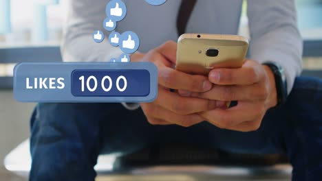 hombre enviando mensajes de texto en su teléfono mientras está sentado en la oficina 4k