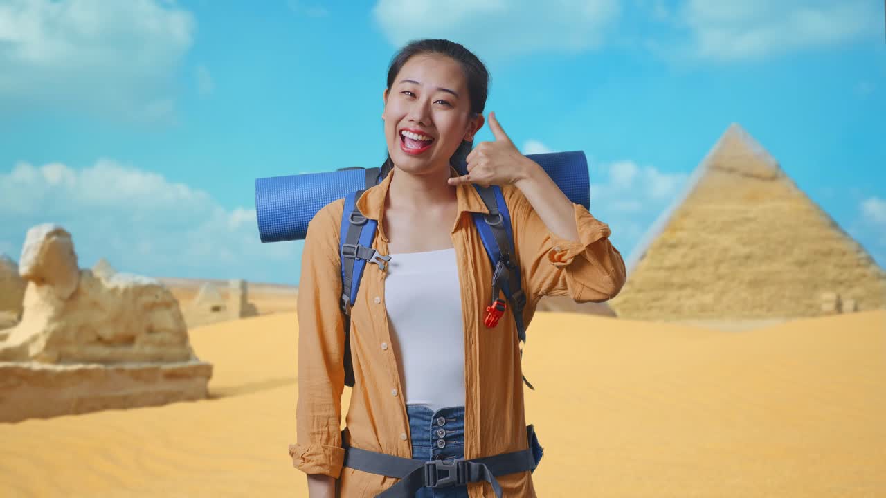 Woman Traveler in Egypt Making a Phone Gesture