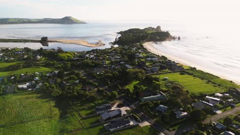 Scenic-Karitane-Coastline,-Huriawa-Peninsula-Near-Dunedin,-New-Zealand---aerial-pullback