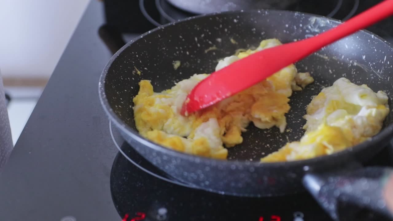 Beautiful footage of a Black woman starting her morning by brewing coffee, preparing a light breakfast, and enjoying the quiet moments of a peaceful day at home.