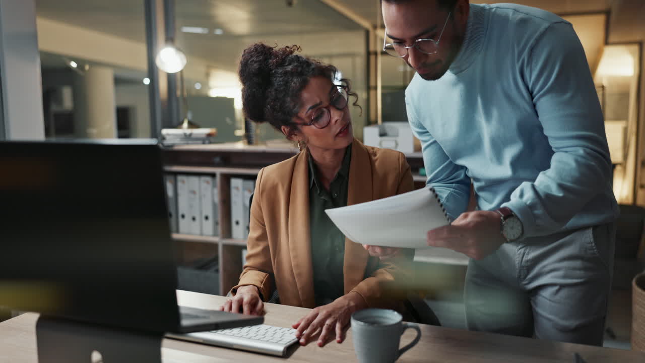 Business Colleagues Collaborating at Night in Office