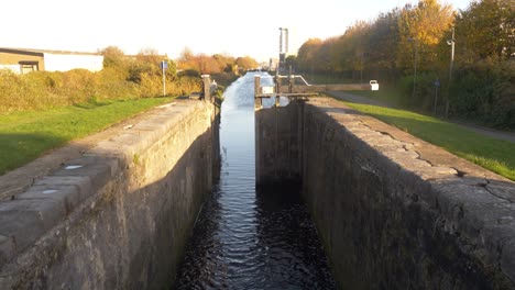 tilt-up reveal of the water sluice of dublin's grand canal in ireland