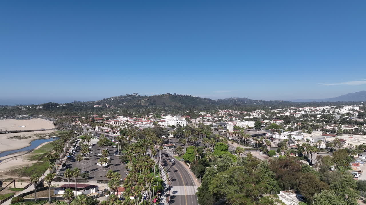 Aerial View of Santa Barbara, California with Coastal City, Palm Trees, and Mountains