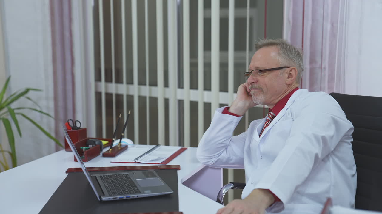 Overworked doctor sitting in his office