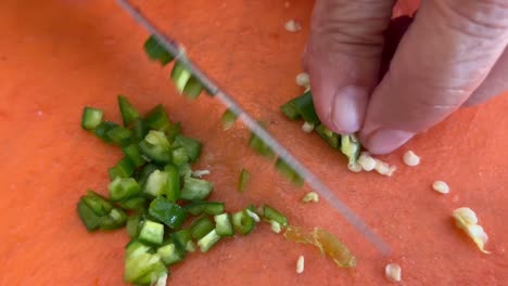 finely chopping jalapeno peppers