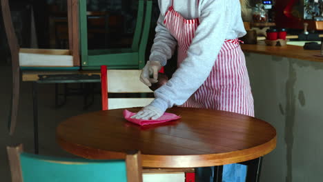 restaurant staff cleaning tables