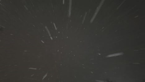 falling down real snowflakes, heavy snow, snowstorm weather, shot on black background, matte, wide angle, seamlessly looped animation, isolated, perfect for digital composition, post-production.