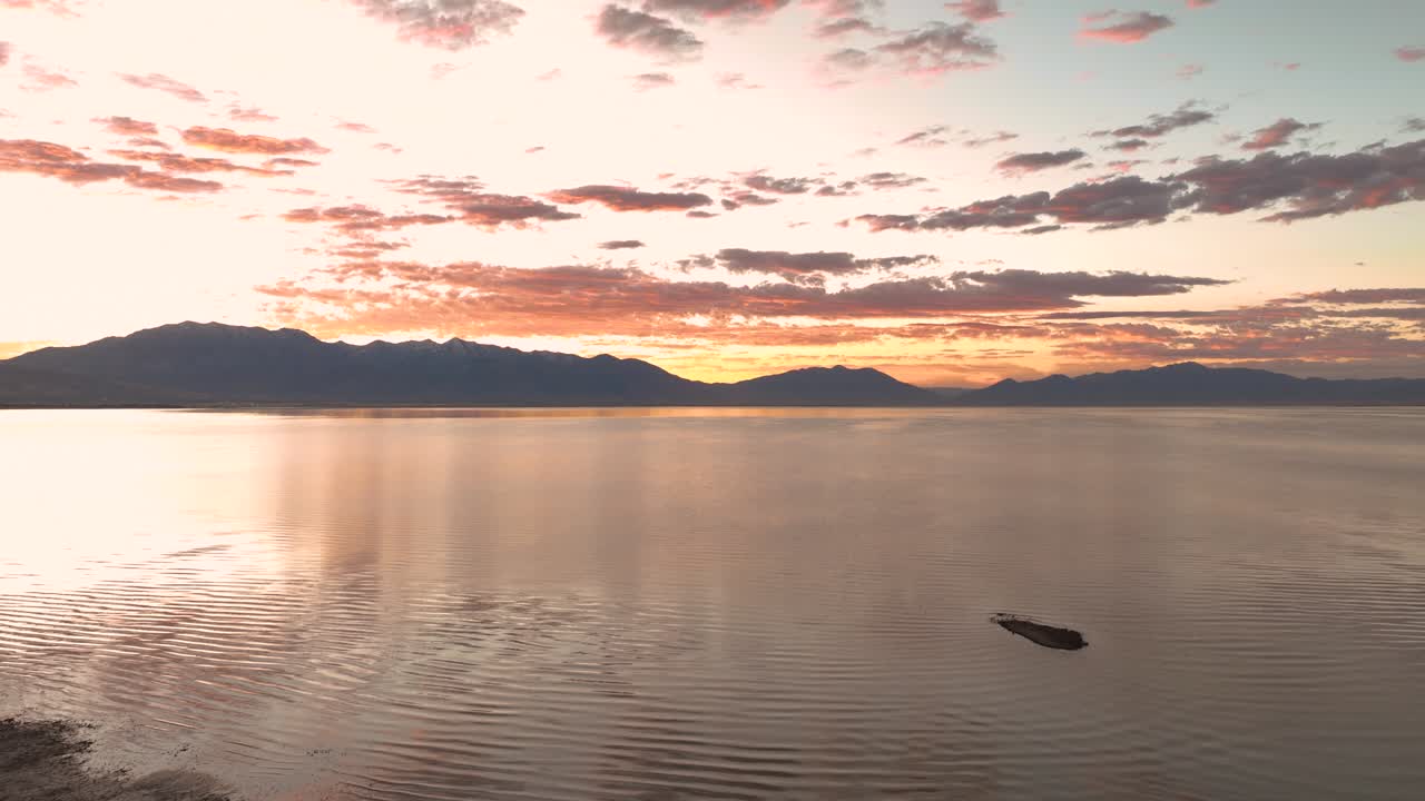 Aerial Flyover Of A Beach At Utah Lake, Beautiful Sunrise Over Mount Timpanogos On The Wasatch Front Range