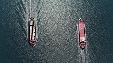 aerial view of two cargo ships sailing on the open sea