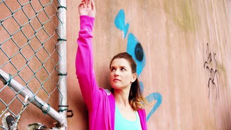 Dancer-leaning-against-wall-outside-dance-studio