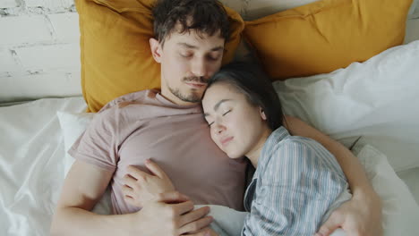 couple sleeping in bed