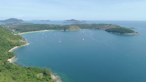 aerial view of tropical sea in phuket island.beautiful sea surface amazing waves seascape mountain view in phuket thailand.high quality footage from drone 4k
