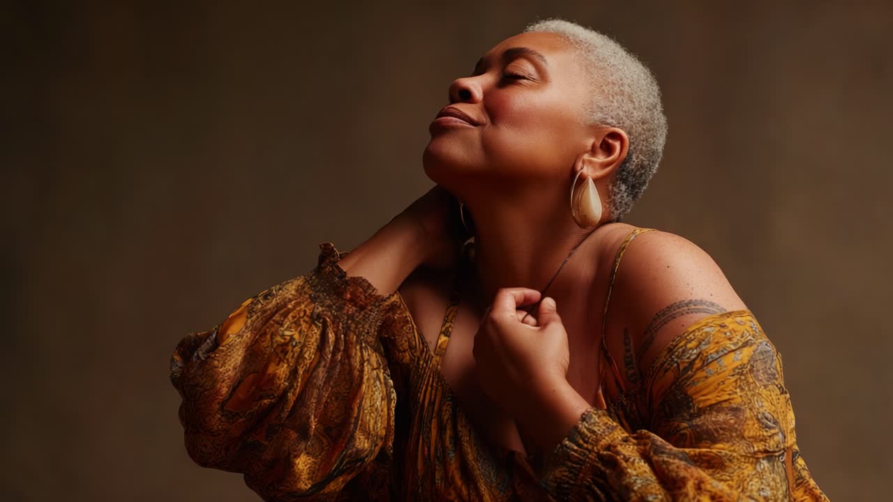 Celebrating Inner Beauty and Confidence: A Close Portrait of a Woman Expressing Joy and Self-Acceptance in a Warmly Lit Setting with Vibrant Attire