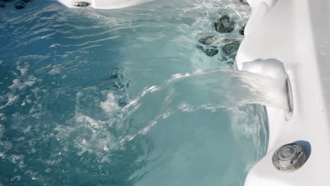 hot tub spa jacuzzi waterfall in a swimming pool