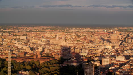 panoramic view of milan city during sunset with cathedral and castle