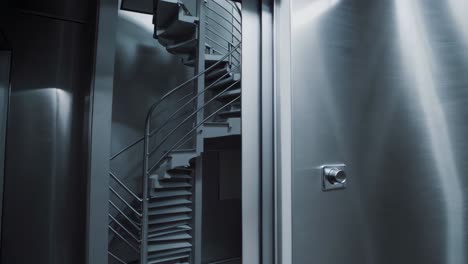 industrial kitchen interior with spiral staircase