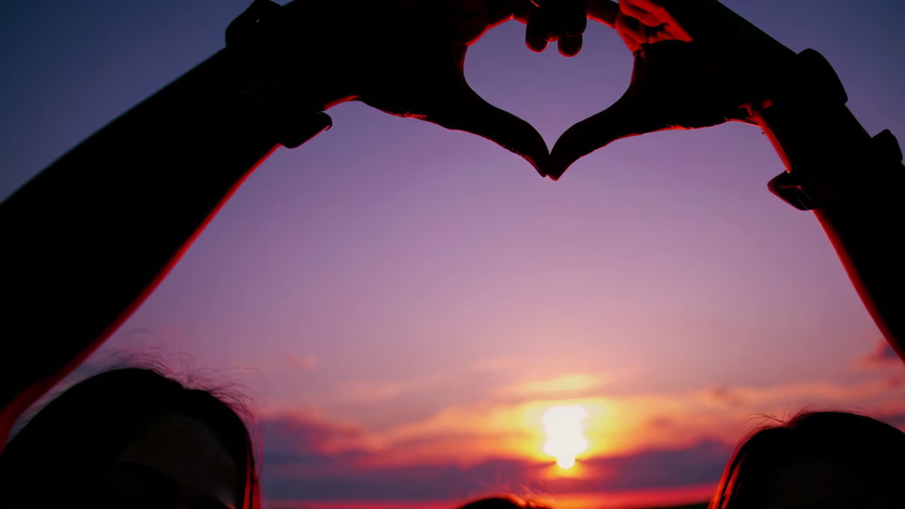 Heart Shaped Hands at Sunset