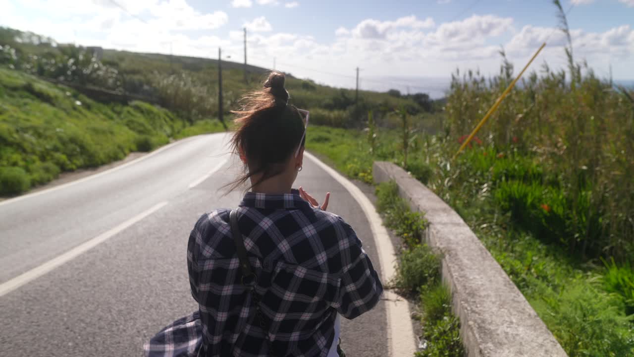 Woman walking on a country road