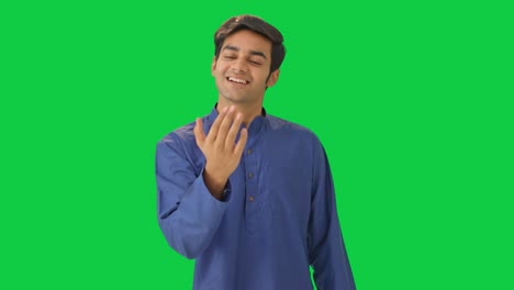 Cute-Indian-man-calling-someone-Green-screen