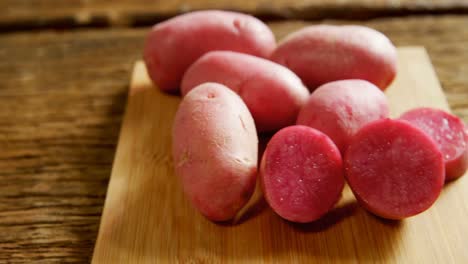 sweet potatoes on a chopping board 4k