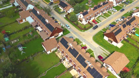 Looking-down,-panel-rooftop-one-the-leading-renewable,-solar-panels-energy-Efficiency-neighborhood-suburb-is-covered-in-rooftop-solar-energy