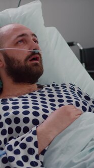 Vertical Video Doctor With Black Skin Monitoring Sick Man Writing 