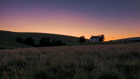 tranquil sunset over a country farmhouse