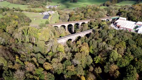 establishing aerial drone clip of marple aqueduct and viaduct in the united kingdom with boats crossing