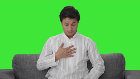 sick indian man having acidity green screen