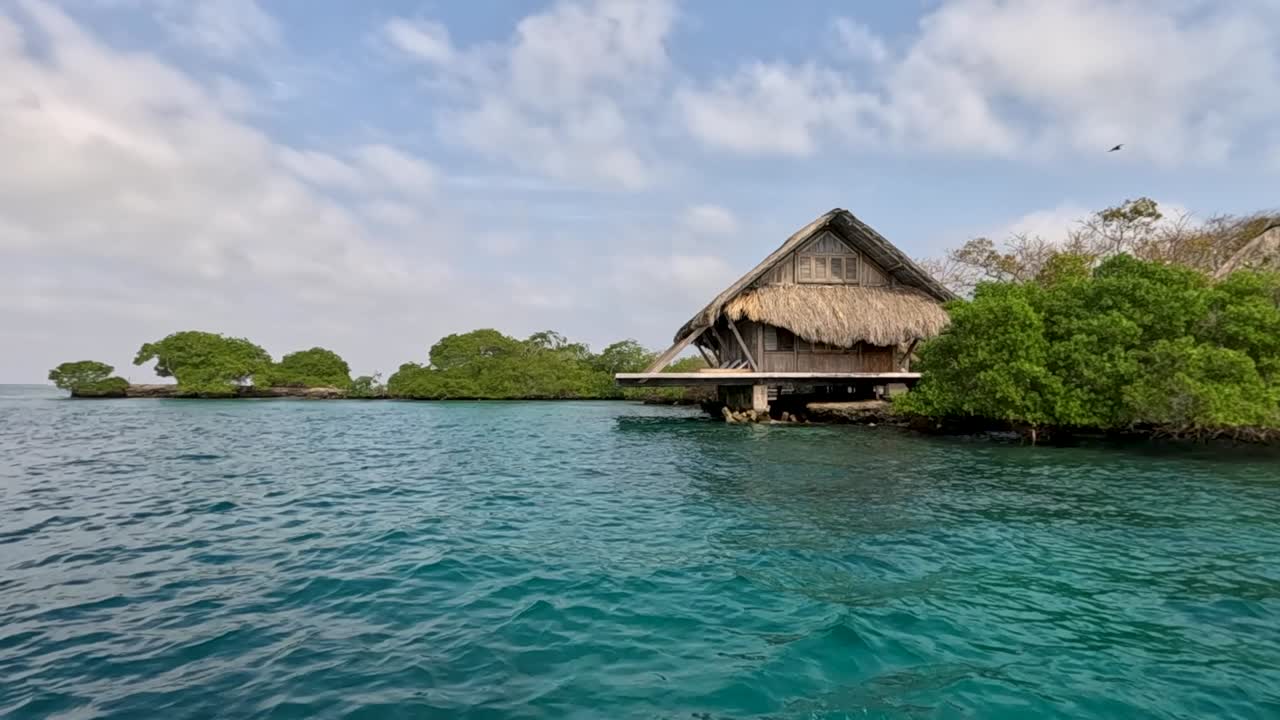 Rosario Island bungalows with clear blue skies and ocean, perfect tropical escape over water