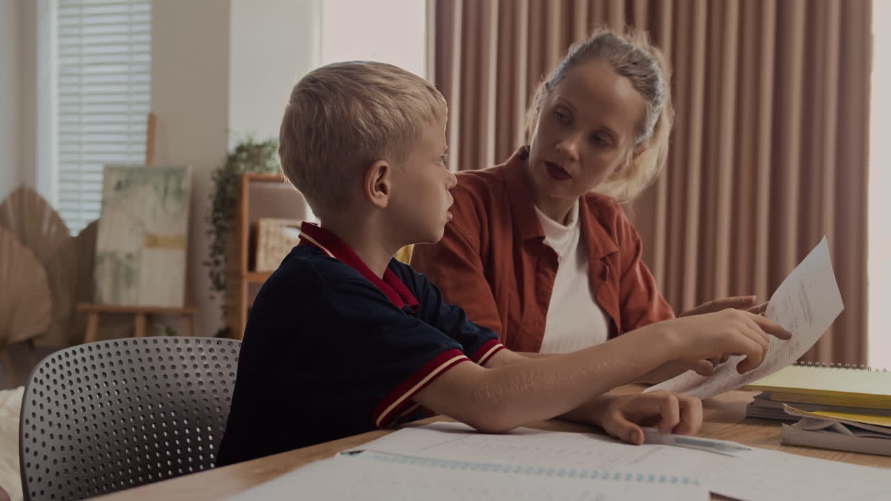 Caucasian Mother Doing Homework with Her Son