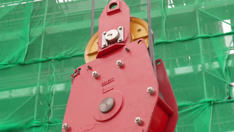 close up of tower crane hook block at work