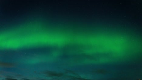 aurora borealis and stars in the night sky in iceland - timelapse